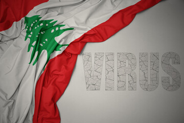 waving colorful national flag of lebanon on a gray background with text virus .