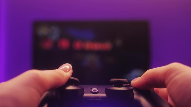 Woman playing game online at home. Gamer girls controlling joystick for video game.