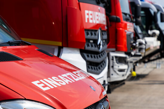 Fire brigade emergency response vehicles parked in a row