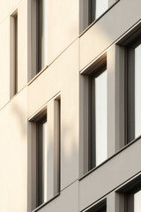 Fototapeta premium Geometric window patterns on modern building facade