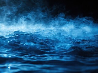 Abstract blue smoke with waves, resembling ocean or water, on black background.