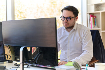 Company Director in a Modern Office, Focused on Work at Computer