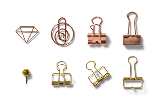 An organized display of assorted metal clips including a diamond shape, spiral, and binder clips, positioned on a pristine white backdrop