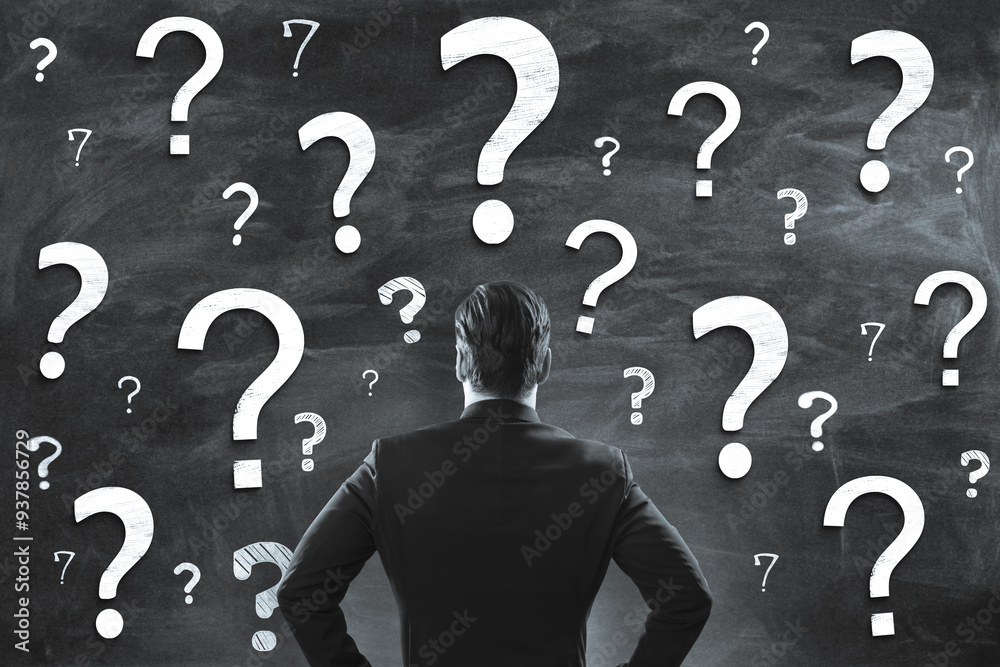 Aufkleber Businessman facing a chalkboard with many question marks drawn on it, symbolizing uncertainty and decision-making in business.