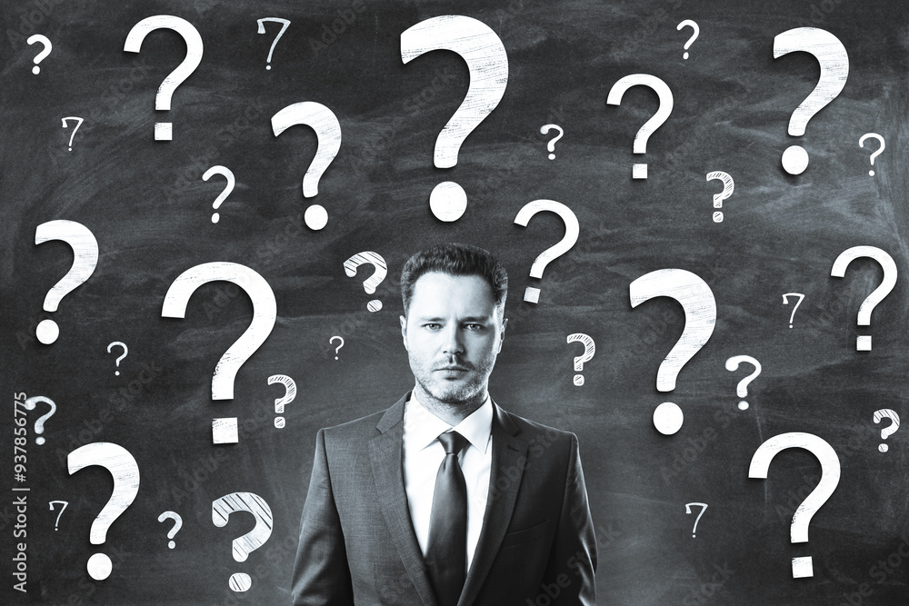 Poster Businessman with question marks on a chalkboard background symbolizing uncertainty and seeking answers.