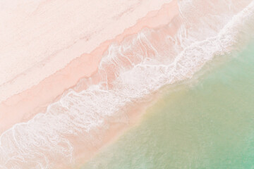 drone aerial view of an empty beach at sunrise, background for a summer concept.