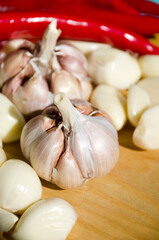 Garlic and chili pepper on a cutting board. Hot spices.