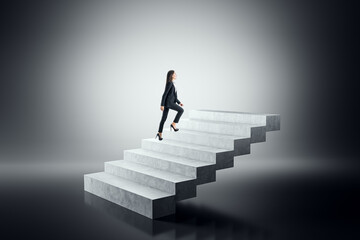 Businesswoman climbing concrete steps on a gradient background.