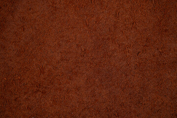 The reverse side of cognac leather, textured background with free space.