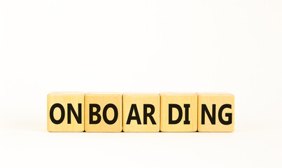 Onboarding success symbol. Concept word Onboarding on wooden blocks. Beautiful white background. Business onboarding success concept. Copy space.