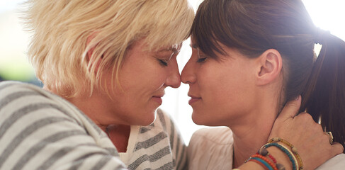 Women, lesbian couple and love with relax, forehead touch and affection in home for bonding together. Female people, partner and romance in embrace, close or relationship on weekend for lgbt marriage