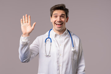 Friendly Mature doctor man waving hand - Hello, Hi. Greetings, Salute on white