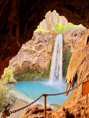 Fototapeta premium Mooney Falls waterfall in Havasupai, warning sign from the cave