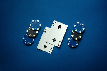 One pair of playing cards in poker gives a small win of chips. The concept of winning in a card game. A lucky win