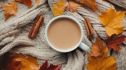 A flat lay of a coffee cup surrounded by autumn leaves, cinnamon sticks, and a soft scarf. Warm tones and a cozy atmosphere make it an ideal scene for fall coffee lovers.