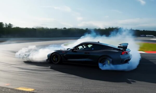 Car drifting on track, intense speed and smoke effects