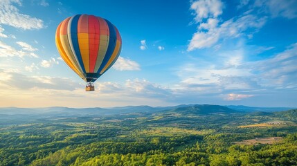 Fototapeta premium Hot Air Balloon Soaring Over Lush Green Landscape - A vibrant hot air balloon floats gracefully against a backdrop of a vast, verdant landscape. The sky is a canvas of fluffy white clouds, symbolizing