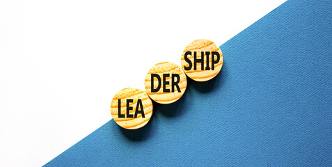 Leadership symbol. Concept word Leadership on beautiful wooden circles. Beautiful blue white...