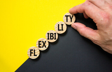 Flexibility symbol. Concept word Flexibility on beautiful wooden circles. Beautiful yellow and...