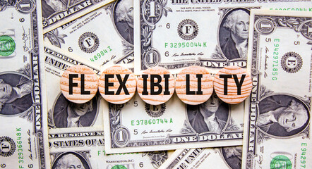 Flexibility symbol. Concept word Flexibility on beautiful wooden circles. Dollar bills. Beautiful...