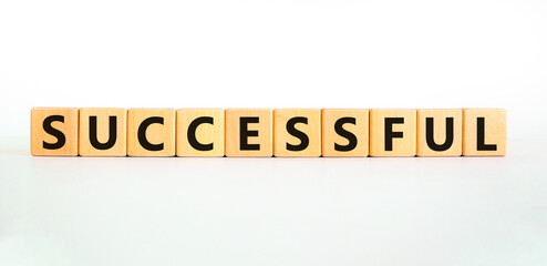 Successful symbol. Concept word Successful on beautiful wooden blocks. Beautiful white background. Business successful concept. Copy space.