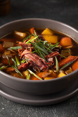 Portion of smoked brisket rustic stew soup