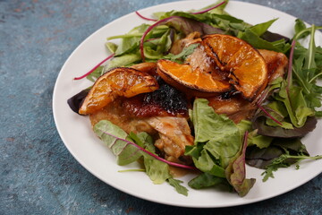 Grilled chicken meat with orange sauce and rosemary.Homemade food