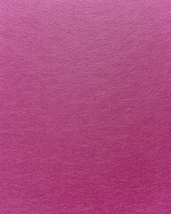 Fototapeta premium Bright pink textured surface with subtle patterns creating a vibrant backdrop for designs