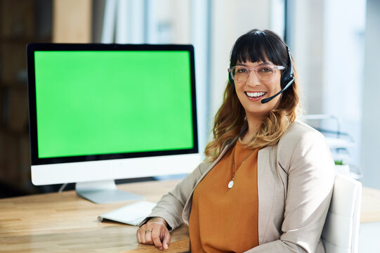 Portrait, businesswoman and green screen in call center for customer service, telemarketing and support. Office, female agent and computer with headset for consulting, listening and helping with FAQ