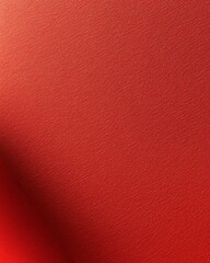 Fototapeta premium A textured red backdrop with subtle variations in shade and light during a soft afternoon light