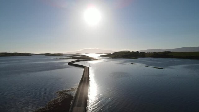 A small road connecting the islands at sunset. Westport, Mayo, Ireland