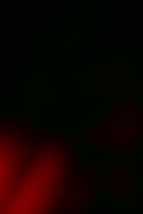 mostly black with some red gradient background