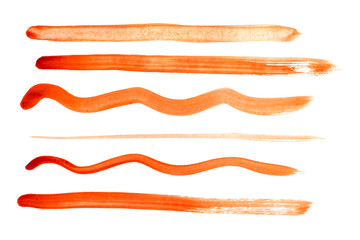 Collection of various orange paint brush strokes on white background.