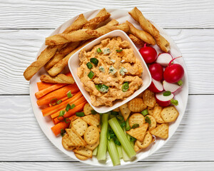 buffalo chicken dip with veggie and bread sticks