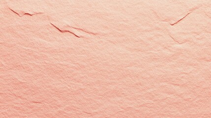 Soft pink textured paper with subtle creases displayed against a neutral background