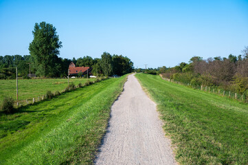 Gravel cycling trail at the green dyke at the seaside around Gr&ouml;mitz, Germany