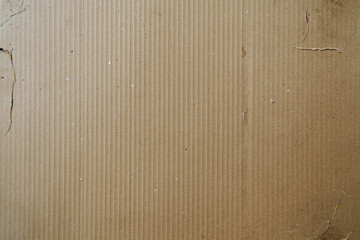 Photo of A beige cardboard texture for product packaging, with visible textured patterns and the appearance of real cardboards