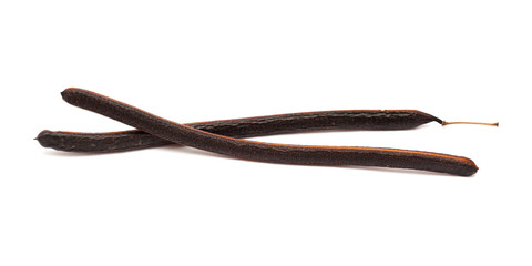 Logs seedpods of Senna spectabilis, golden wonder tree, isolated on white background