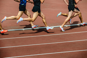 Fototapeta premium group athletes running 800 meters at stadium