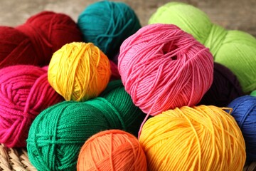 Many different yarns on blurred background, closeup