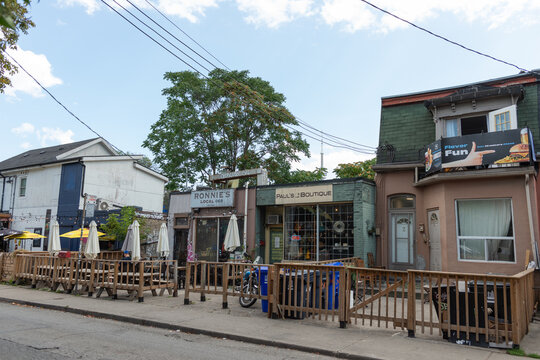 exterior view of Ronnie's Local 069, a pub, and Paul's Boutique, a guitar store, both located at 69 Nassau St in Toronto's Kensington Market area