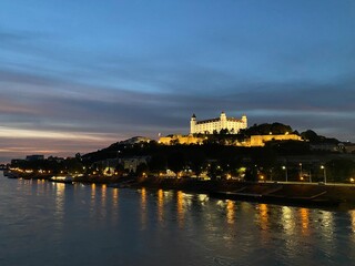 Bratislava Castle and the Danube at night.