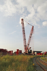 Fototapeta premium a big crane for lifting heavy weight at a field in the countryside