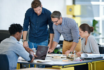 Discussion, business people and coworking in office for brainstorming, planning and ideas for startup. Graphic designers, employees and manager in creative agency for advice, feedback and listening