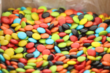 collage of colored candies in the market