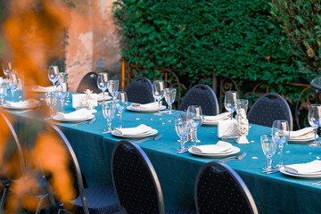 served table by cutlery outdoor yard garden spring time space for holidays festive dinner