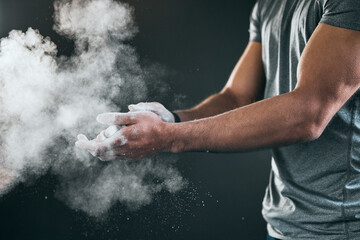Fitness, athlete and hands with powder in gym for exercise grip, muscle training and workout routine. Bodybuilder, person and chalk dust at sports center for weightlifting practice and preparation