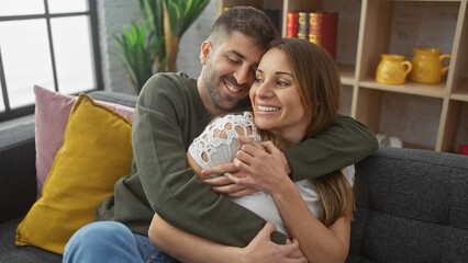 Affectionate couple embracing with love indoors, showcasing a cozy home atmosphere with a man and...