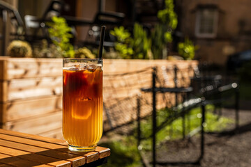 Bumble cold coffee drink, espresso and orange juice, on the terrace of a cafe