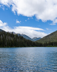 Beautiful waters of the Lightning Lake at Manning Park British Columbia Canada with clouds over the mountains